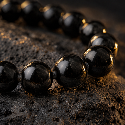 Close view of polished natural black obsidian beads